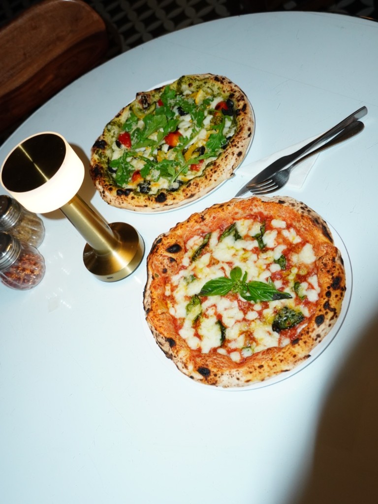 Margherita and pesto veggie Neapolitan pizzas with leopard-charred crust at Naples in a Box